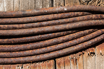 Old sling rusty knot with wood, selective focus
