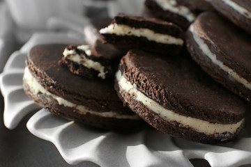 Tasty chocolate cookies on plate, closeup