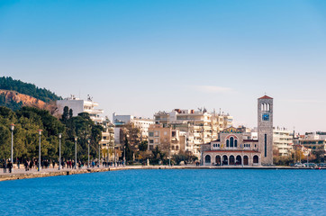 View of a seaside street in the center of Volos.The church of Saint Constantine and Helen in background.