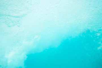 Obraz na płótnie Canvas background image of water surface, blue sea, bubbles