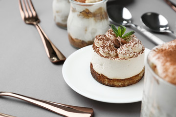 Tasty tiramisu on grey background