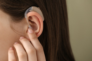 Woman with hearing aid, closeup