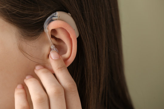 Woman with hearing aid, closeup
