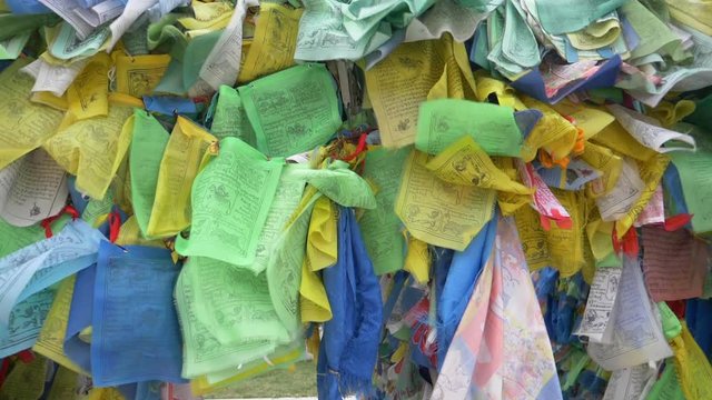 Colorful Tibetan prayer flags swaying in the wind in the temple, Ulan Ude Russia