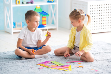 boy with a girl playing at home