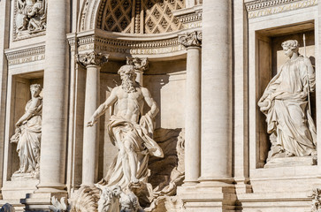 Fototapeta premium Statues of Oceanus, Abundance and Health on the Trevi fountain by Nicola Salvi and Giuseppe Pannini in Rome, Italy