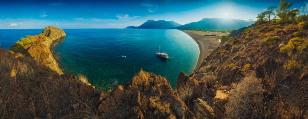 Fototapeta premium Panorama of Cirali beach and Olimpos mountain in a sunset