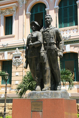 statues of workers in saigon (vietnam)