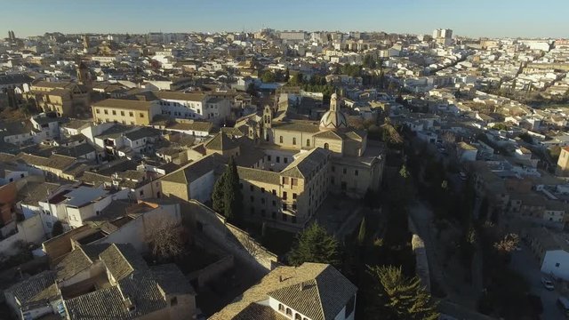 Circling shot of a church in Ubeda town - UNESCO World Heritage Site in Renaissance style in Jaen province, Andalusia, Spain located on a hill surrounded by olive groves,