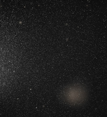 Snow flies in the sky at night as a background