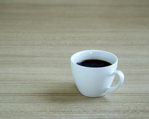 Coffee cup on wood background