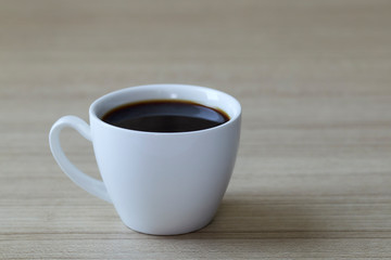 Coffee cup on wood background