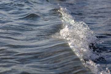 Waves on the seashore as an abstract background