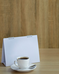 Holiday concept coffee and empty calendar