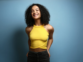 Beautiful African-American woman on color background