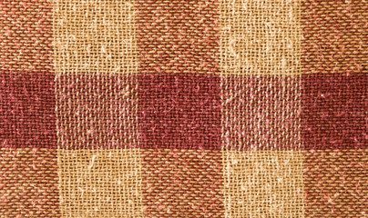 Close up abstract of block checked shape cotton print fabric background. Seamless colorful cloth textile texture of light crisscross pattern. Natural canvas. Studio shot with copy space room for text.