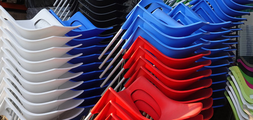 Colorful plastic chairs stacked