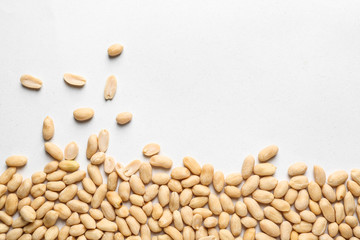 Tasty peanuts on white background