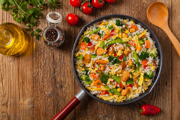 Nasi goreng. Fried rice with egg and vegetables.