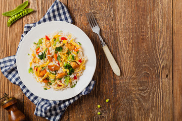 Nasi goreng. Fried rice with egg and vegetables.