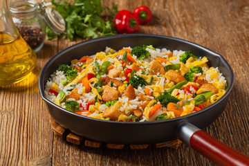 Nasi goreng. Fried rice with egg and vegetables.