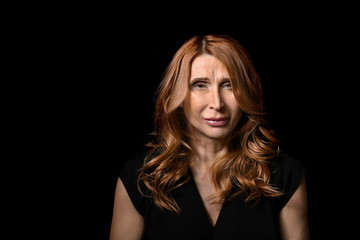 Fototapeta premium Mature woman on dark background