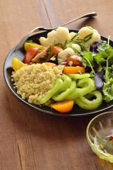 Vegetarian salad with quinoa, vegetables and sunflower seeds. Buddha bowl, vertical 