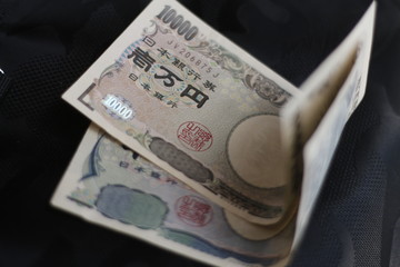  Ten thousand yen bills and thousand yen bills. Japanese money and culture