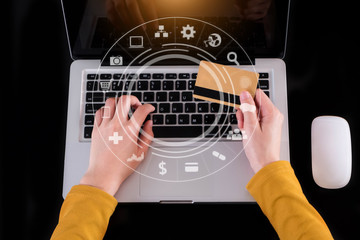 Obraz na płótnie Canvas Women use laptop computers for laptop payments, online shopping, omni channels, sitting at desks.