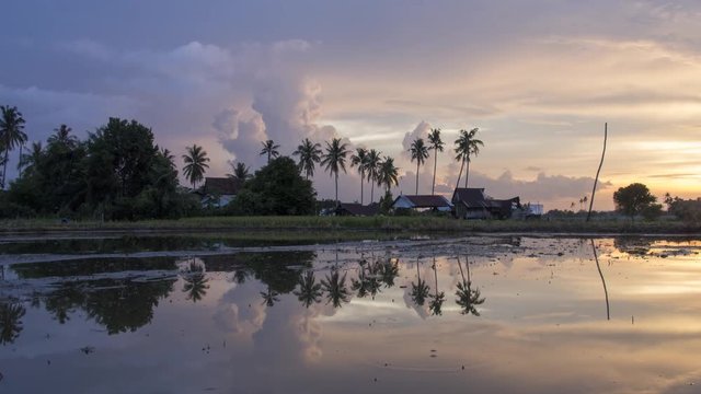 Timelaps sunset over Malay kampung house at Malaysia.