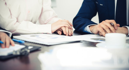 Group of business people at meeting  discussing financial results 