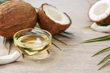 Bowl with coconut oil on table