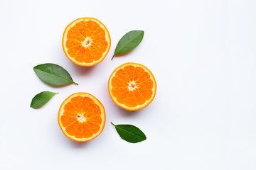 Fresh orange citrus fruits with leaves on white background.