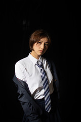 Asian Chinese girl dressed in school uniform cosplay PUBG character wearing school uniform, an iron halmet, and M16 toy gun.