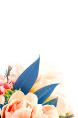 Beautiful bouquet of pink tulips with blue leaves and other decorative flowers close up.