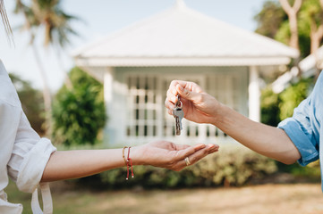 Real-estate agent giving keys to new property owners