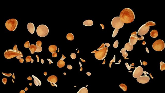 Pancakes flying in slow motion against black
