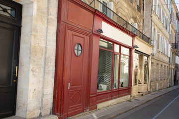Fototapeta na wymiar street antique shop in Bordeaux Paris street with blank empty frame place