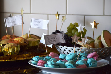 Coffee break with a cake buffet including cupcakes, fruit and french macarons
