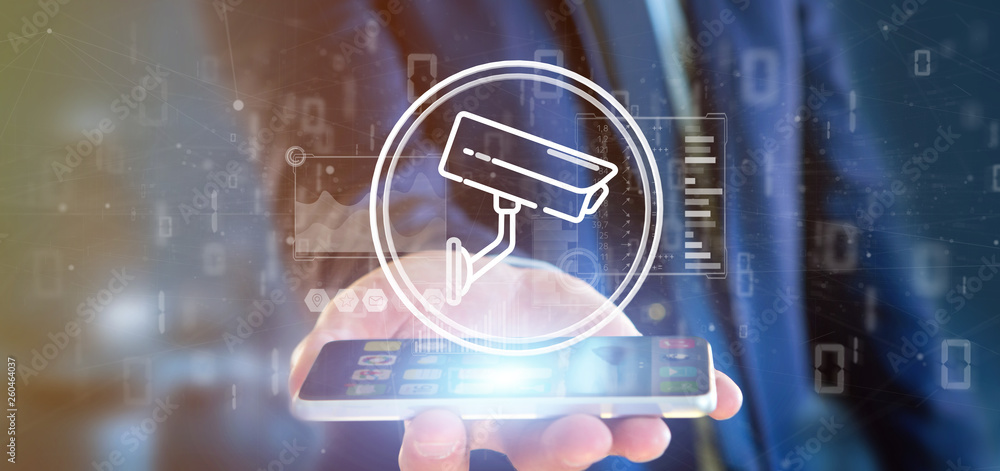 Poster businessman holding security camera system icon and statistics data - 3d rendering