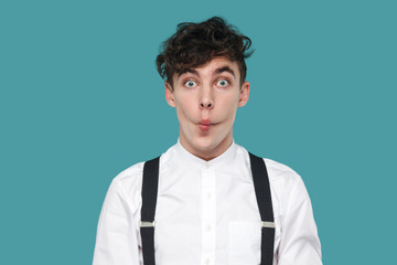Funny surprised man with fish lips, big eyes looking at camera.