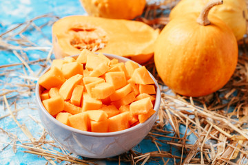 ingredients for pumpkin soup on a wooden background