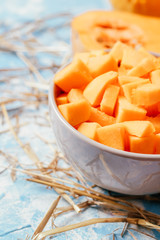 ingredients for pumpkin soup on a wooden background