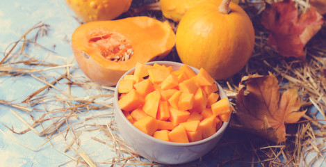 ingredients for pumpkin soup on a wooden background