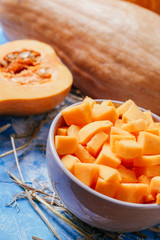ingredients for pumpkin soup on a wooden background