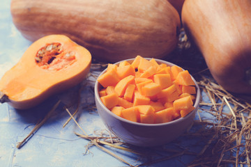 ingredients for pumpkin soup on a wooden background