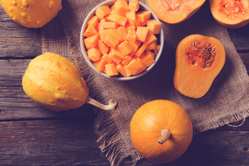 ingredients for pumpkin soup on a wooden background