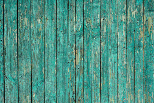 Blue painted plank fence with cracked and scratch. Horizontal old texture