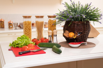 Fresh vegetables and utensils for cooking classes on white table