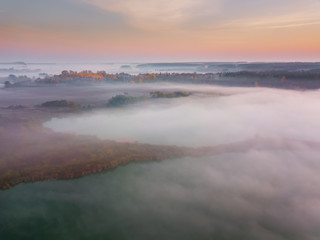 Beautiful misty dawn. Flying above the clouds, aerial view